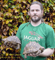 Marcus holding an adult pair of Indian Star Tortoises